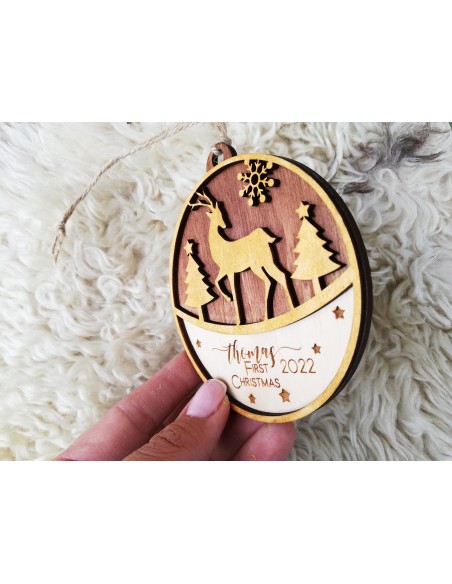 Round wooden Christmas tree ornament with deer