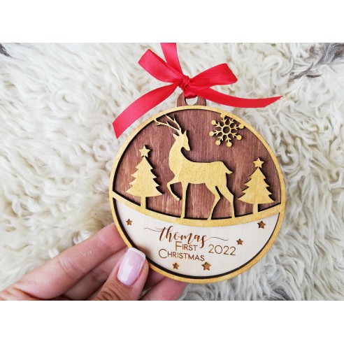 Round wooden Christmas tree ornament with deer