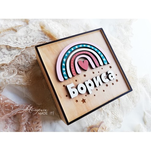 A  wooden box with a rainbow for a girl
