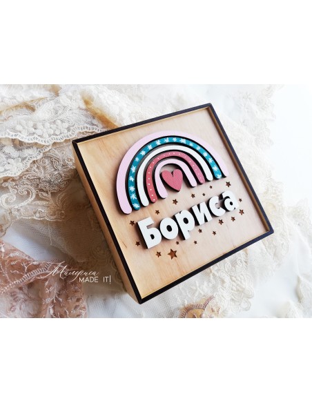 A  wooden box with a rainbow for a girl