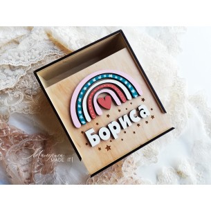 A  wooden box with a rainbow for a girl