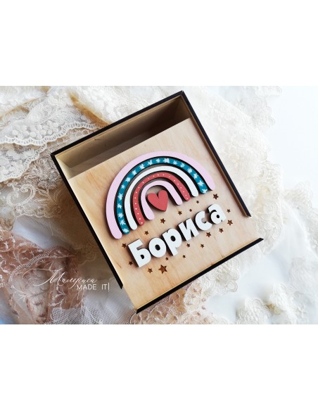 A  wooden box with a rainbow for a girl