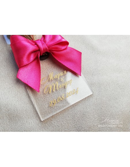 Guest gift with satin ribbon and dried flowers