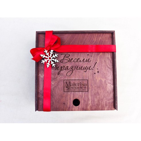 Open square box with corporate gourmet products and elegant arrangement