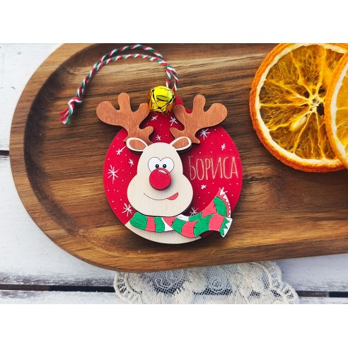 Personalized wooden Christmas ornament with a reindeer and a bell