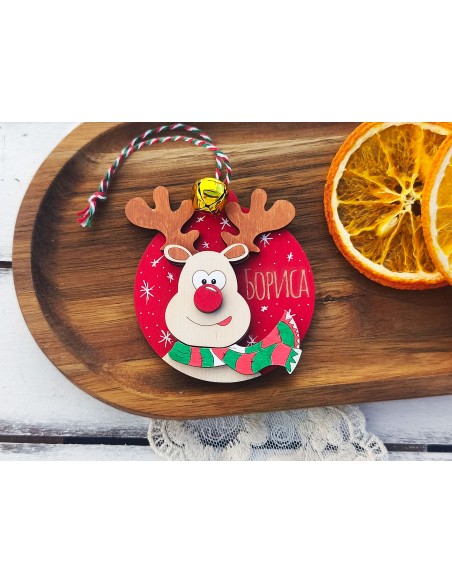 Personalized wooden Christmas ornament with a reindeer and a bell
