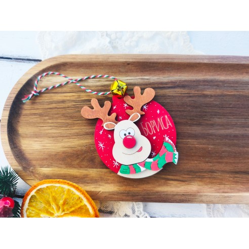 Laser-cut wooden Christmas ornament with a child's name