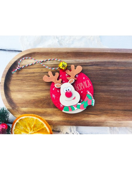 Laser-cut wooden Christmas ornament with a child's name