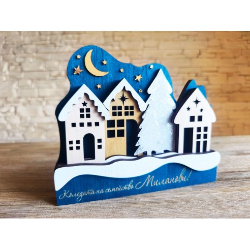 Family Christmas decoration with houses and a night sky