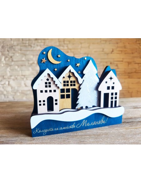 Family Christmas decoration with houses and a night sky