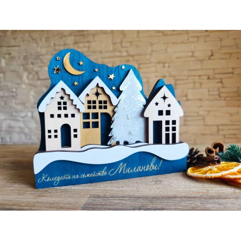 Wooden decoration with Christmas houses and gold stars