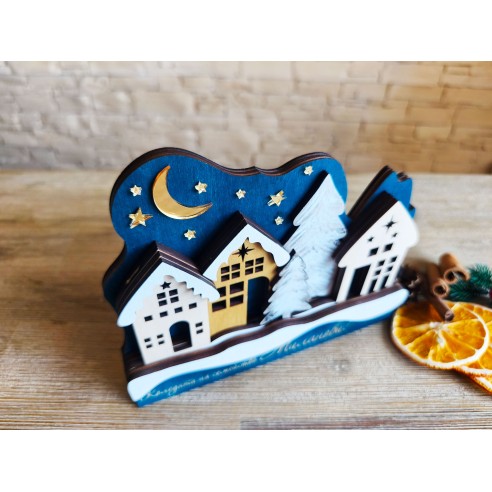 Christmas decor with houses and a decorative tree