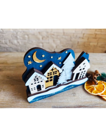 Christmas decor with houses and a decorative tree